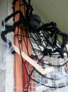 Spider Mama in my Halloween display playing hockey with her babies.